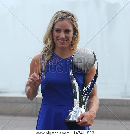 NEW YORK - SEPTEMBER 11, 2016: Two times Grand Slam champion Angelique Kerber of Germany poses with the WTA No.1 trophy  after her victory at US Open 2016 at Billie Jean King National Tennis Center