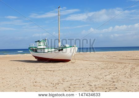 Fishing boats stranded on the beach at low tide