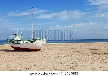 Fishing boats stranded on the beach at low tide