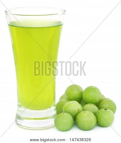 Herbal amla juice with fresh fruits over white background