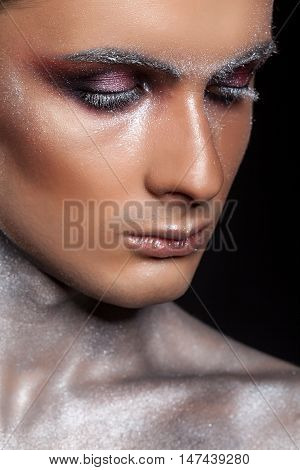 Man In Creative Make Up With Glitter And Eyelashes