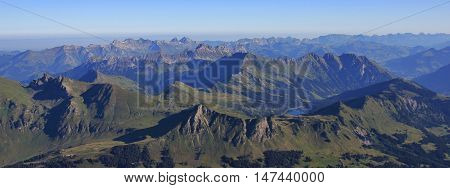 Mountain ranges in the Swiss Alps. View from Sex Rouge. Lake Arnensee.