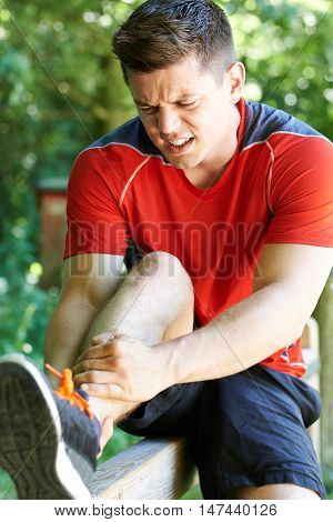 Man With Sports Injury Sustained Whilst Exercising Outdoors