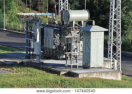 Modern big oil voltage transformer at the substation