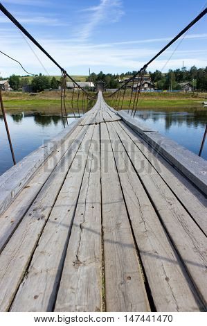 Rural Landscape At Summer With Wooden Suspension Bridge