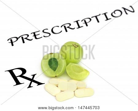 Amla fruits with pills in a prescription