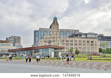 YOKOHAMA, JAPAN - SEPTEMBER 27, 2014: Unidentified people walk around Zou-no-hana Terrace and Yokohama Customs Museum in Kanagawa Prefecture, Japan. The terrace is located in Zou-no-hana Park.