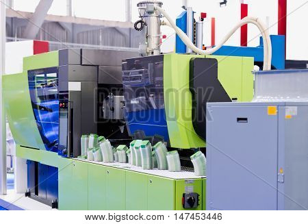 Industrial plastic injection moulding machine, color image, close up