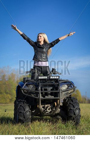 Elegant Blonde Woman Riding Extreme Quadrocycle Atv On Summer Field