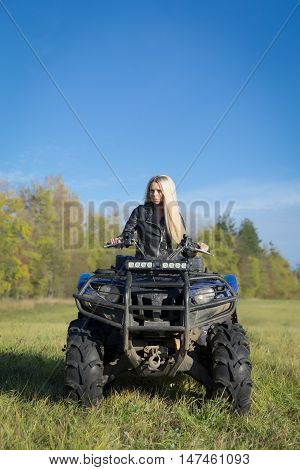 Elegant Blonde Woman Riding Extreme Quadrocycle Atv On Summer Field