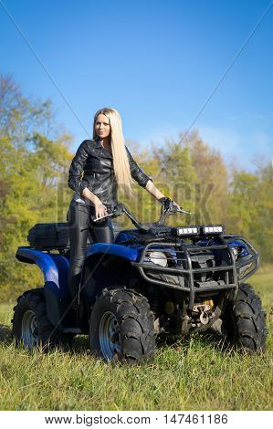 Elegant Blonde Woman Riding Extreme Quadrocycle Atv On Summer Field
