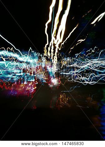 abstract traffic light in motion blur on the road at night