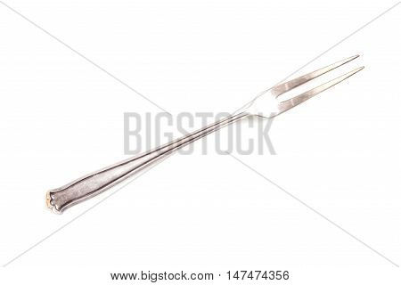 Antique cupronickel fork on a white background isolated