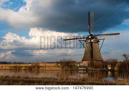 Windmill in Kindeijk, Netherlands with dramatic sky.