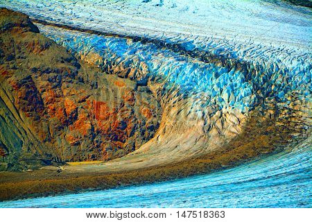 Alaska rocks glacier multicolor frozen snow and ice