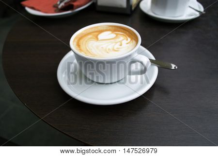 Morning cup of coffee in the street cafe