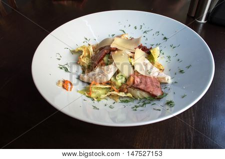 Delicious salad with chicken on the big plate