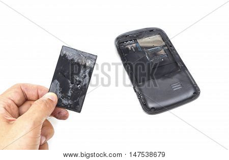 Smartphone with battery problem / Hand holding a mobile phone battery burn due to overheat