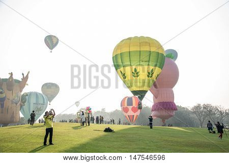 CHIANGRAI THAILAND - FEBRUARY 15 2016 : Hot air Balloons ready to rise into the sky in the morning at SINGHA PARK CHIANGRAI BALLOON FIESTA 2016 Chiangrai province Thailand