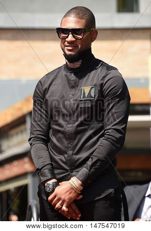 LOS ANGELES - SEP 07:  Usher arrives to the Walk of Fame honors Usher on September 07, 2016 in Hollywood, CA                