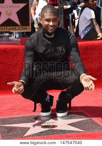 LOS ANGELES - SEP 07:  Usher arrives to the Walk of Fame honors Usher on September 07, 2016 in Hollywood, CA                
