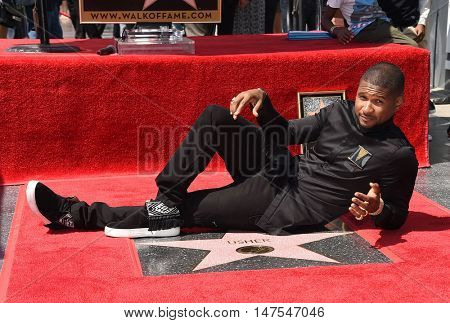 LOS ANGELES - SEP 07:  Usher arrives to the Walk of Fame honors Usher on September 07, 2016 in Hollywood, CA                