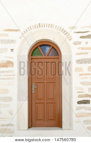 Arched doorway of the local church of Marpissa village at Paros island.