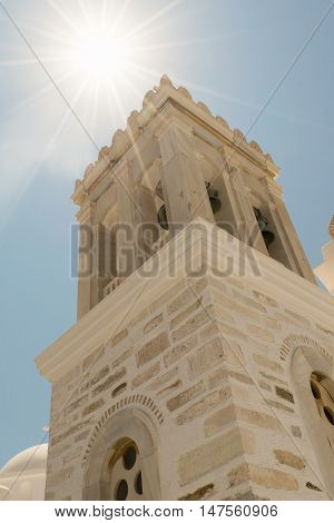 Marpissa's village local church at Paros island in Greece against the sun.