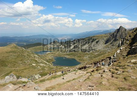 A small lake with blue water in the mountains