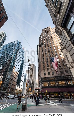 New York City USA - November 14 2011: Pedestrians at the intersection of 57th Street and Broadway Manhattan.