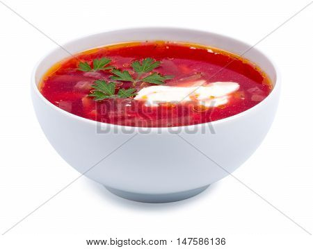 Hot borsch in a white bowl isolated on a white background