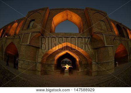 sunset time to historical stone bridge of 33 arches in isfahan, iran at September 15, 2016.