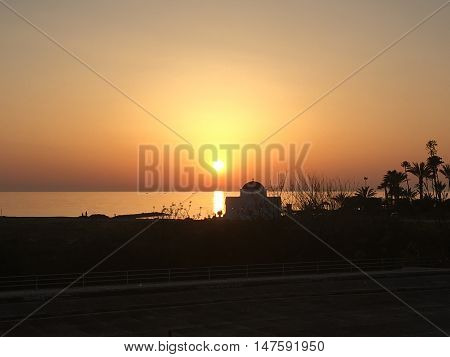 Lovely sunset in Paphos, Cyprus in a hot summers evening.