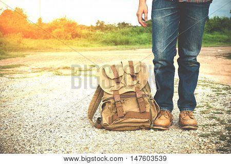 Young man traveler with backpack travel concept