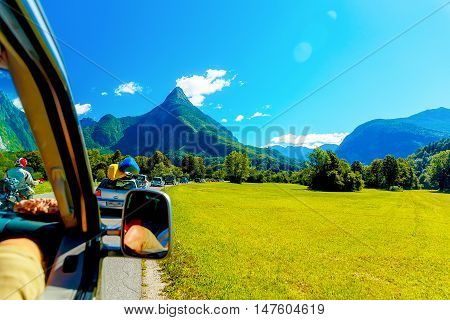 free summer car travelling road trip in beautiful mountain landscape.