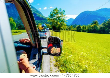 free summer car travelling road trip in beautiful mountain landscape.