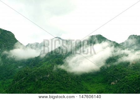 View of misty fog mountains in winter of Thailand.