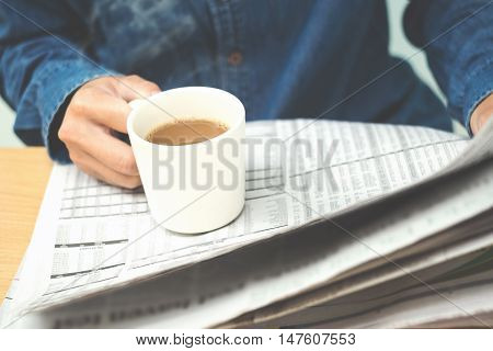 Close up man reading newspapers (Soft focus)