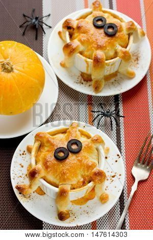 Halloween octopus pot pie. Tentacle pot pies. Portion pot pies with dough tentacles wrapping down the sides of the bowl. Funny idea for festive dinner. Adorable treats for Halloween party for kids