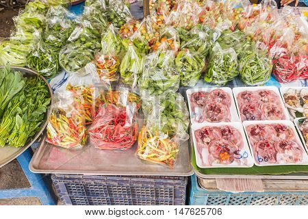Various fresh vegetables and animals selling at local Thai market Northeast of Thailand