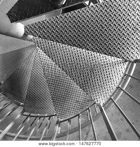 Spiral Stair Detail. Metal diamondplate staircase inside a farm silo.