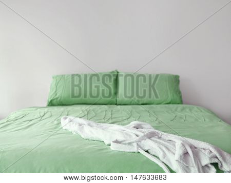 Green bedding with robe