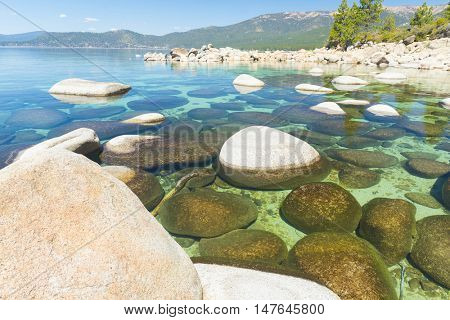 Beautiful boulders and crystal clear water of the lake Tahoe. Hidden Beach, Lake Tahoe - Nevada, USA