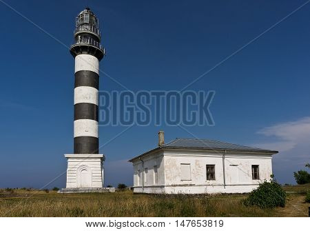 Lighthouse and hause on the small island in the Baltic Sea. Architecture on the Osmussaar Estonia Europe.