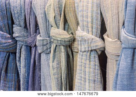 fabric and textiles in a shop. Multi different colors and on the market.