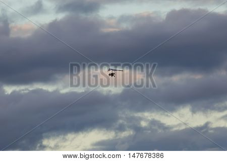 trike on a background of clouds in the evening sky