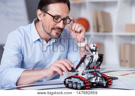Science of Future. Male in glasses performing calculations with a help of new technologies