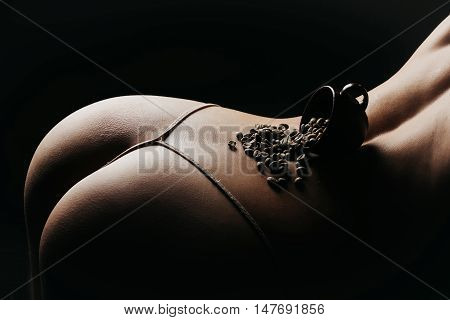 Sexy Female Buttocks With Coffee Beans And Cup