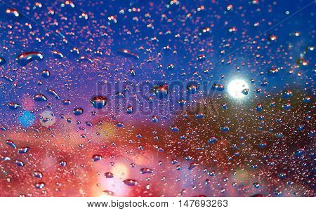 Abstract picture : Close up of car glass when Traffic jam at night and rainning