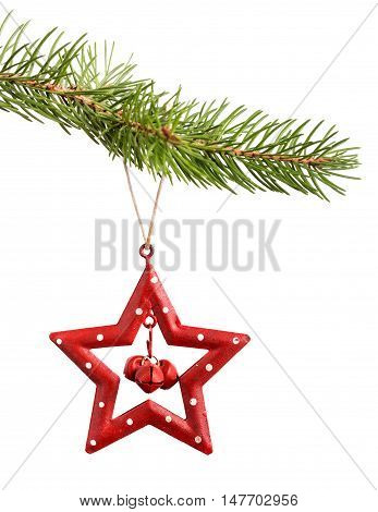 Christmas red star decoration hanging on fir-tree branch isolated on white